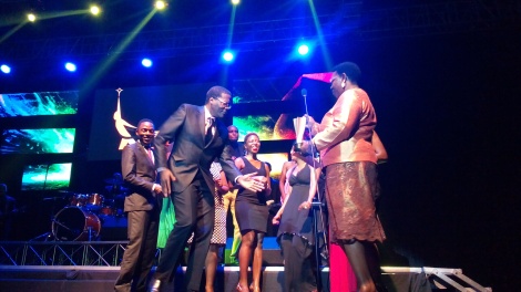 Dr Miria Matembe joins NDOA team from Mavuno Church in a dance after winning award for Church Project Of The Year. 