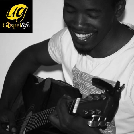 Josh. O. Agaba Playing An Acoustic Guitar. 